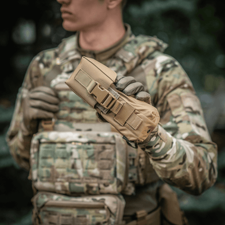 M-Tac Double Magazine Pouch with Fastex closure used by a person in military uniform for quick access to magazines.