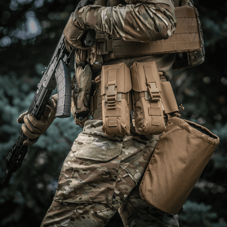M-Tac Double Magazine Pouch with Fastex closure on a soldier wearing a camouflage outfit, ideal for quick access and secure transport.