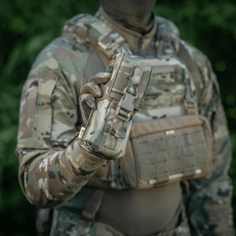 M-Tac Double Magazine Pouch with Fastex Closure in camouflage design held by soldier in the field
