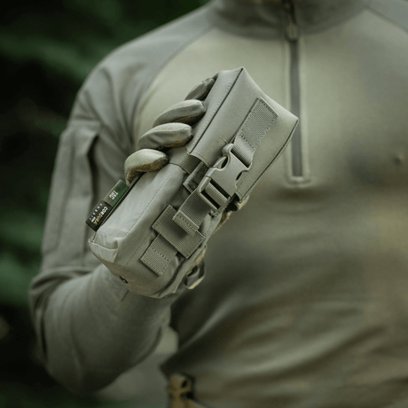 M-Tac Double Magazine Pouch with Fastex Closure in durable Cordura 500D, ideal for military use, shown in hand