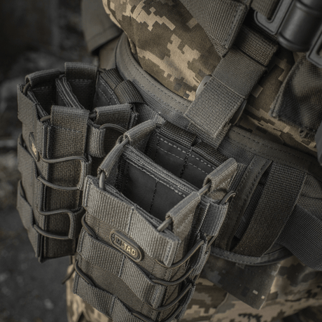 M-Tac open double magazine pouch for AK on field gear, rugged design for secure storage of AK magazines in extreme conditions.