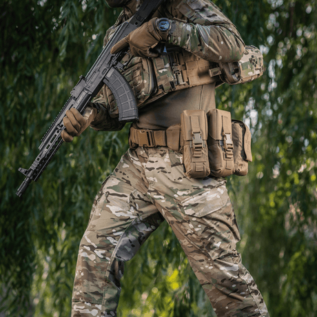 M-Tac War Belt ARMOR worn by a tactically equipped soldier, showing durability and the MOLLE system in a field environment.