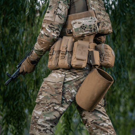 Tactical gear worn by a soldier with M-Tac War Belt ARMOR, designed for individual combat setups with MOLLE webbing and Cordura 500D.