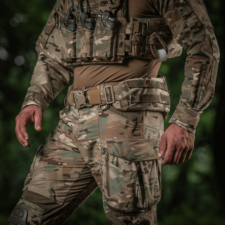 M-Tac War Belt ARMOR tactical belt in use with camouflage clothing and MOLLE webbing for combat tasks.