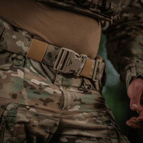 Soldier wearing M-Tac War Belt ARMOR with MOLLE webbing and robust buckle closures, designed for tactical missions.