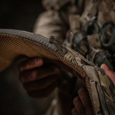 Close-up of M-Tac War Belt ARMOR in use, showing details of the hard-wearing Cordura 500D fabric with MOLLE webbing for fastening accessories.