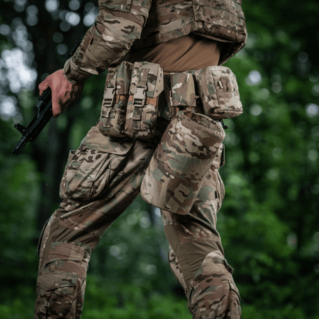 Tactical operator with M-Tac War Belt ARMOR, equipped with MOLLE system and Cordura 500D for fit and customization.