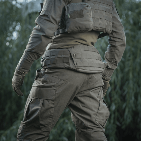 M-Tac War Belt ARMOR worn by a tactical specialist outdoors, showing MOLLE-webbing for attaching gear.