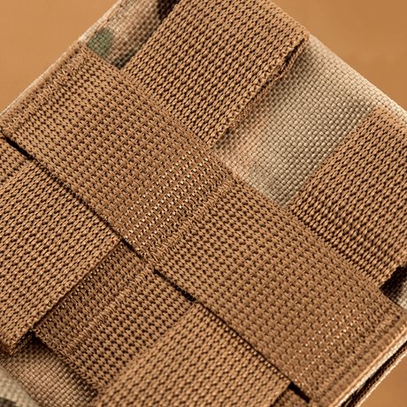 Close-up of M-Tac Mag Drop Pouch Elite with MOLLE attachments, securing magazines and gear in place