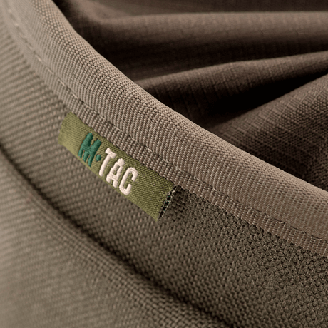 Close-up of M-Tac Mag Drop Pouch Elite focusing on the robust fabric and M-Tac logo. Designed for secure magazine storage with MOLLE attachments