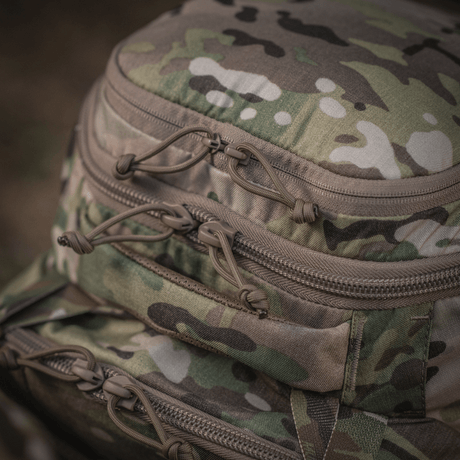 Details of M-Tac Large Gen.IV Elite in camo with robust zippers, made of durable Cordura.