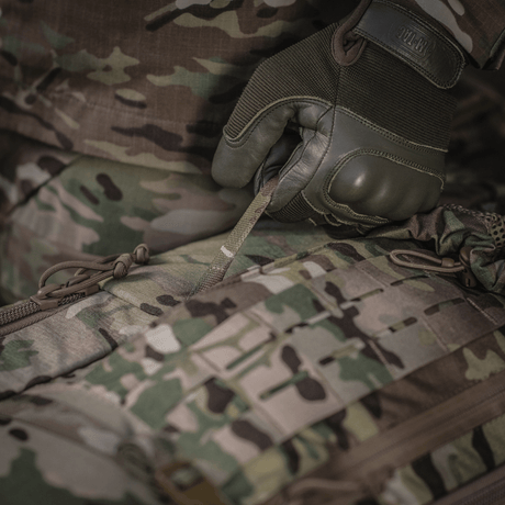 Detailed image of M-Tac Large Gen.IV Elite in use, showing durable Cordura material in camouflage design.