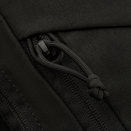Close-up of the zipper on M-Tac Magnet XL Bag Elite, a practical shoulder bag with innovative magnetic clasp and velcro panel.