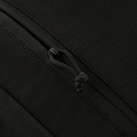 Close-up of zipper detail on M-Tac Magnet XL Bag Elite in black fabric.
