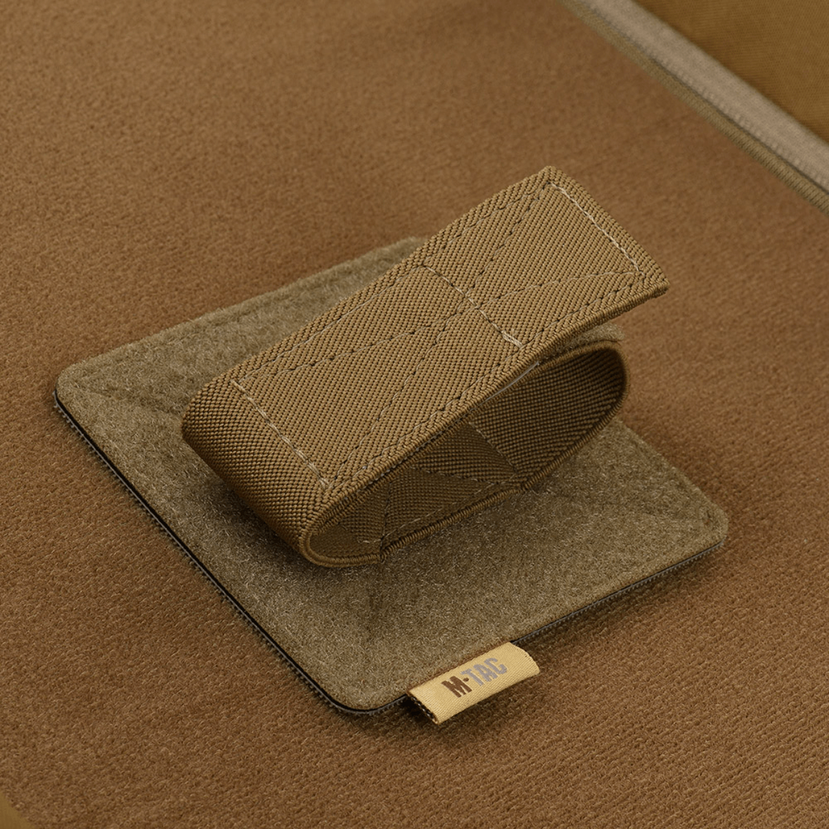 M-Tac Gun Backpack Case 125 cm Gen.II Elite indvendig velcrostrop til ekstra sikkerhed og taktik i tasken, lavet af holdbart materiale.