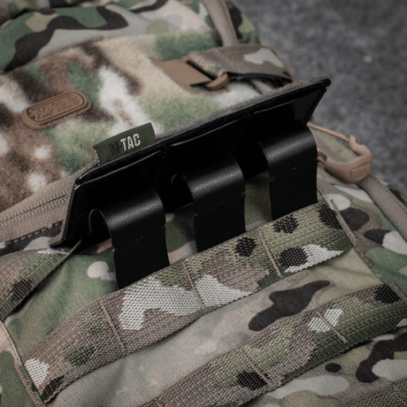 M-Tac Tactical Morale Patch Display Board Hook and Loop Molle 120x85 on a MOLLE backpack with camouflage design.