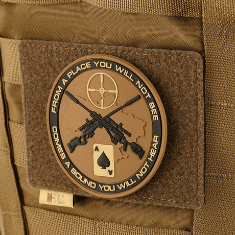 M-Tac Tactical Morale Patch Display Board Hook and Loop Molle 120x85 with a novelty patch and MOLLE system attached.