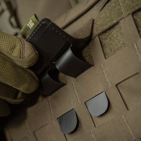 M-Tac MOLLE Patch Panel 80x85 fastened to MOLLE system with plastic base for stability and hook & loop surface for patches