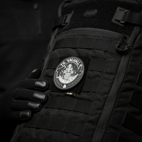 M-Tac MOLLE patch panel 80x85 mm mounted on a black bag with 'Til Valhalla' patch for close, stable attachment.