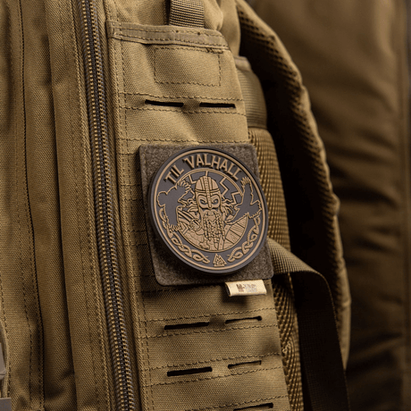 M-Tac MOLLE patch panel 80x85 mm mounted on a green bag with 'Til Valhall' patch.