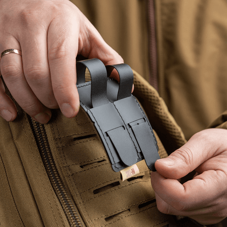 M-Tac MOLLE patch panel 80x85 mm attached to a MOLLE system, with hook & loop surface and plastic base for stability.