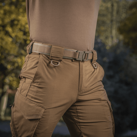 M-Tac Cobra Buckle Tactical Belt Laser Cut secured to pants in an outdoor setting, suited for military and police.