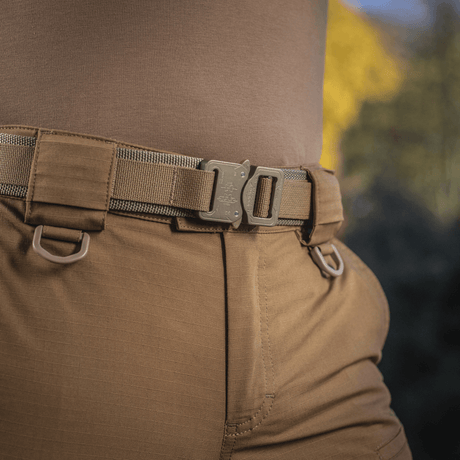 Person wearing M-Tac Cobra Buckle Tactical Belt Laser Cut with AustriAlpin COBRA buckle outdoors.