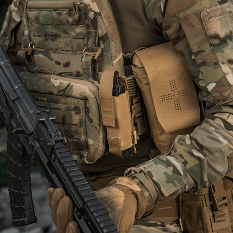 M-Tac Tourniquet Pouch Elastic VELCRO Gen.II on a soldier with tactical gear in a camouflage pattern