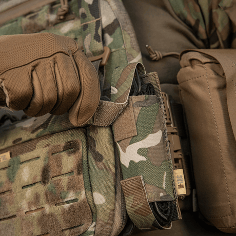 M-Tac Tourniquet Pouch Elastic VELCRO Gen.II attached to camouflaged gear, quick access, tactical use