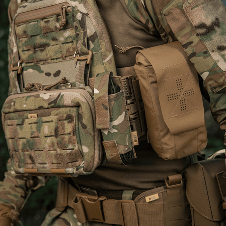 M-Tac Tourniquet Pouch Elastic VELCRO Gen.II mounted on a tactical vest in woodland camouflage, made of robust Cordura 500D, quick access