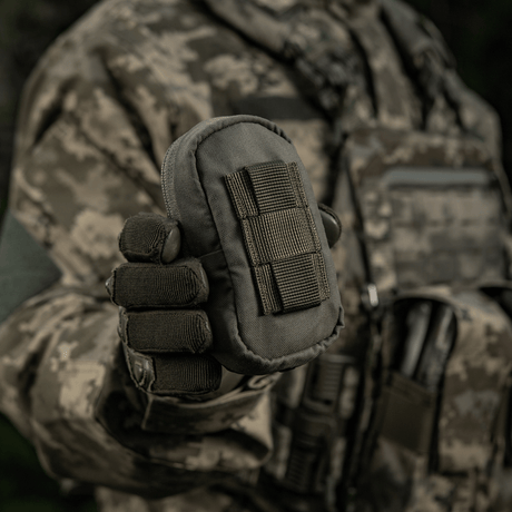 M-Tac PC Utility Pouch Elite in camouflage attire, Cordura material with MOLLE interface, shown in a military environment. Tactical storage pouch