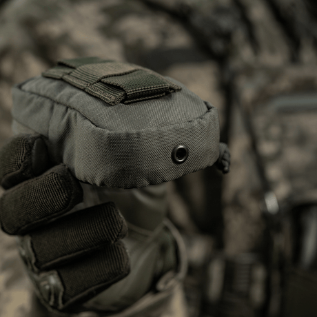 M-Tac PC Utility Pouch Elite in Cordura with MOLLE interface, held by a person in tactical gear, ideal for small storage tasks