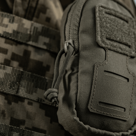 M-Tac PC Utility Pouch Elite in Cordura with MOLLE interface and Velcro panel on tactical gear, for small-item storage.