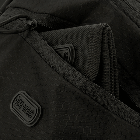Close-up of M-Tac Sphaera Hex Hardsling Bag with zip compartments and M-Tac label, made of durable Cordura/Hex polyester.