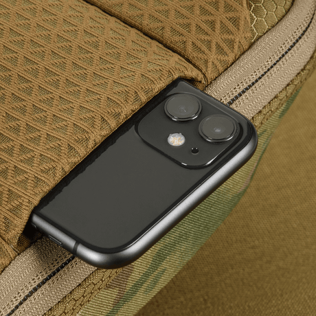 Detail image of a smartphone in M-Tac Sphaera Hex Hardsling Bag Gen.II Elite, highlighting functionality and style.