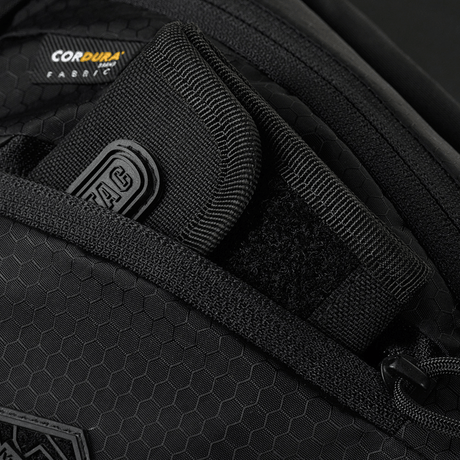 Close-up of M-Tac Sphaera Hex Hardsling Bag Gen.II Elite with Cordura Hex polyester and concealed carry compartment, zipper details.