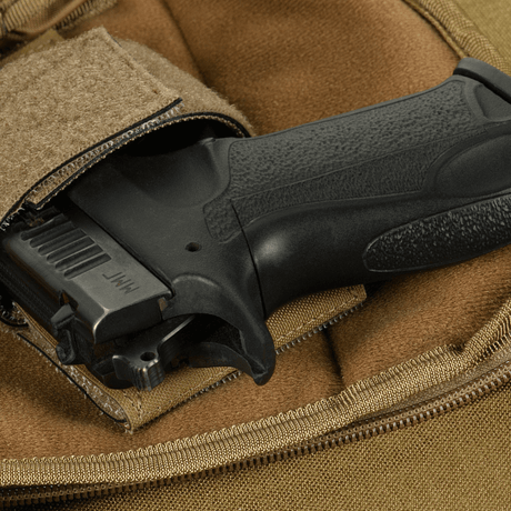 Concealed carry feature in M-Tac Sphaera Hex Hardsling Bag Gen.II Elite, showing bag with weapon storage and zipper closure.