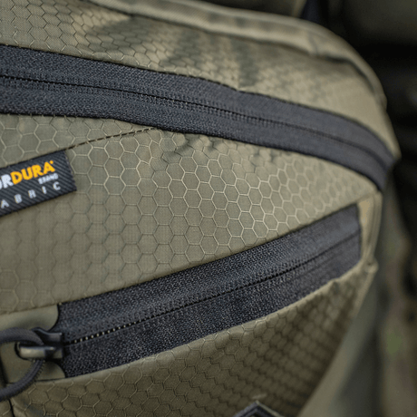 M-Tac Sphaera Hex Hardsling Bag Gen.II Elite in Cordura material with hex pattern and zipper detail. Focused on functional bag design.