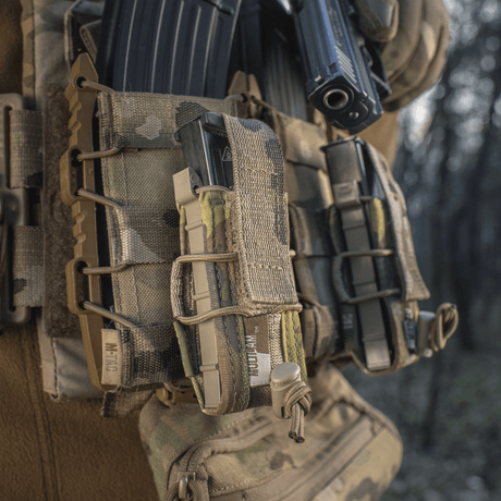 M-Tac Pistol Mag Pouch Gen.3 in Cordura 500D with MOLLE mounting and elastic for adjustable magazine retention in forest environment.