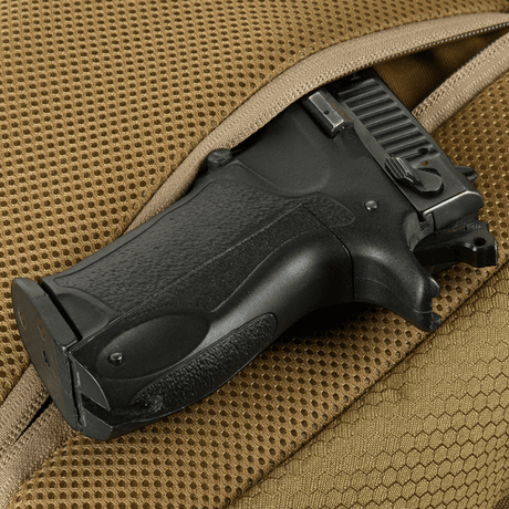 M-Tac Magnet XL Bag Elite Hex, bag with universal holster, showing a black pistol grip in a brown sachet bag.
