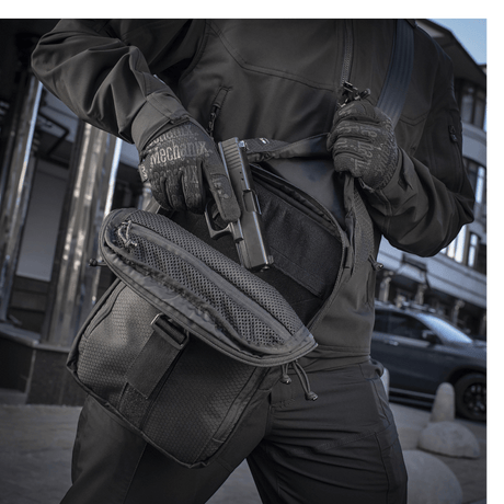 Man wearing M-Tac Magnet XL Bag Elite Hex with FidLock lock for quick and secure closure.