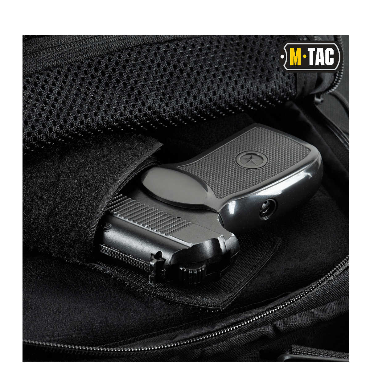 M-Tac Magnet XL Taske Elite Hex med universelt hylster og FidLock låsesystem, viser indvendig pistolopbevaring i sort taske.