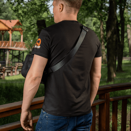 M‑Tac Cross Bag Elite Hex worn on the shoulder outdoors in a forest, rear view, 5 L volume