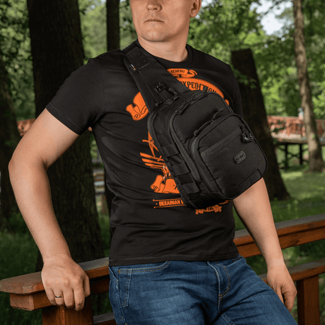 Man wearing M‑Tac Cross Bag Elite Hex, a Cordura 500 sling pack for daily and tactical use