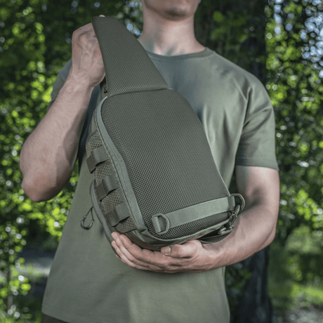 Man wearing M-Tac Cross Bag Elite Hex, a compact bag and backpack in Cordura 500, ideal for daily use and tactical gear.