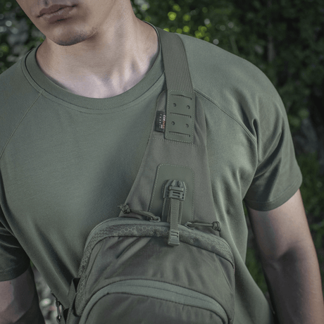 M-Tac Cross Bag Elite Hex in use on a person wearing a green t-shirt, suitable for both everyday use and tactical gear.