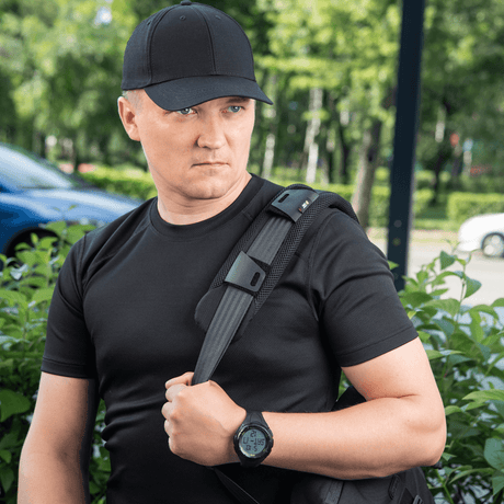 Man wearing a backpack with M‑Tac Shoulder Strap Pad 50 mm Elite for comfort and weight distribution.
