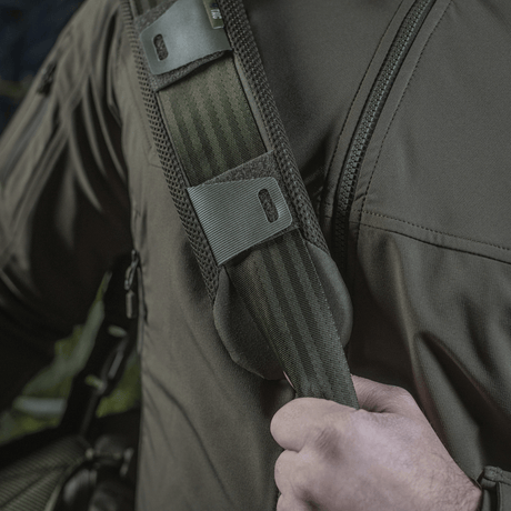 Man wearing M‑Tac Shoulder Strap Pad 50 mm Elite on the shoulder for comfort and support.
