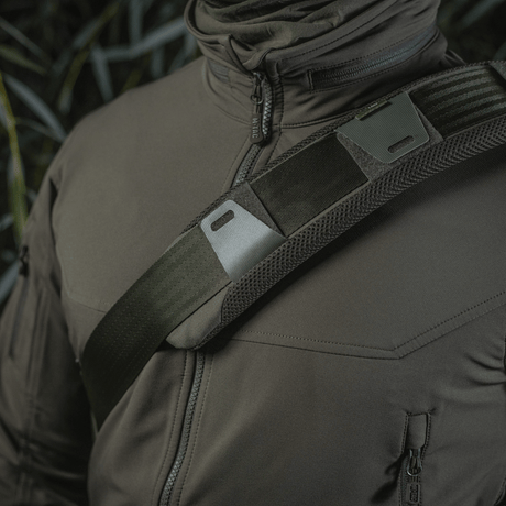 M‑Tac Shoulder Strap Pad 50 mm Elite on a person's shoulder for optimal comfort and pressure relief, with breathable 3D mesh and rugged Cordura material.