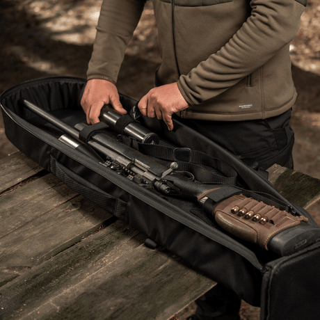 M-Tac Gun Backpack Case 105 cm Elite Hex with weapon secured inside, perfect for hunters and shooters.